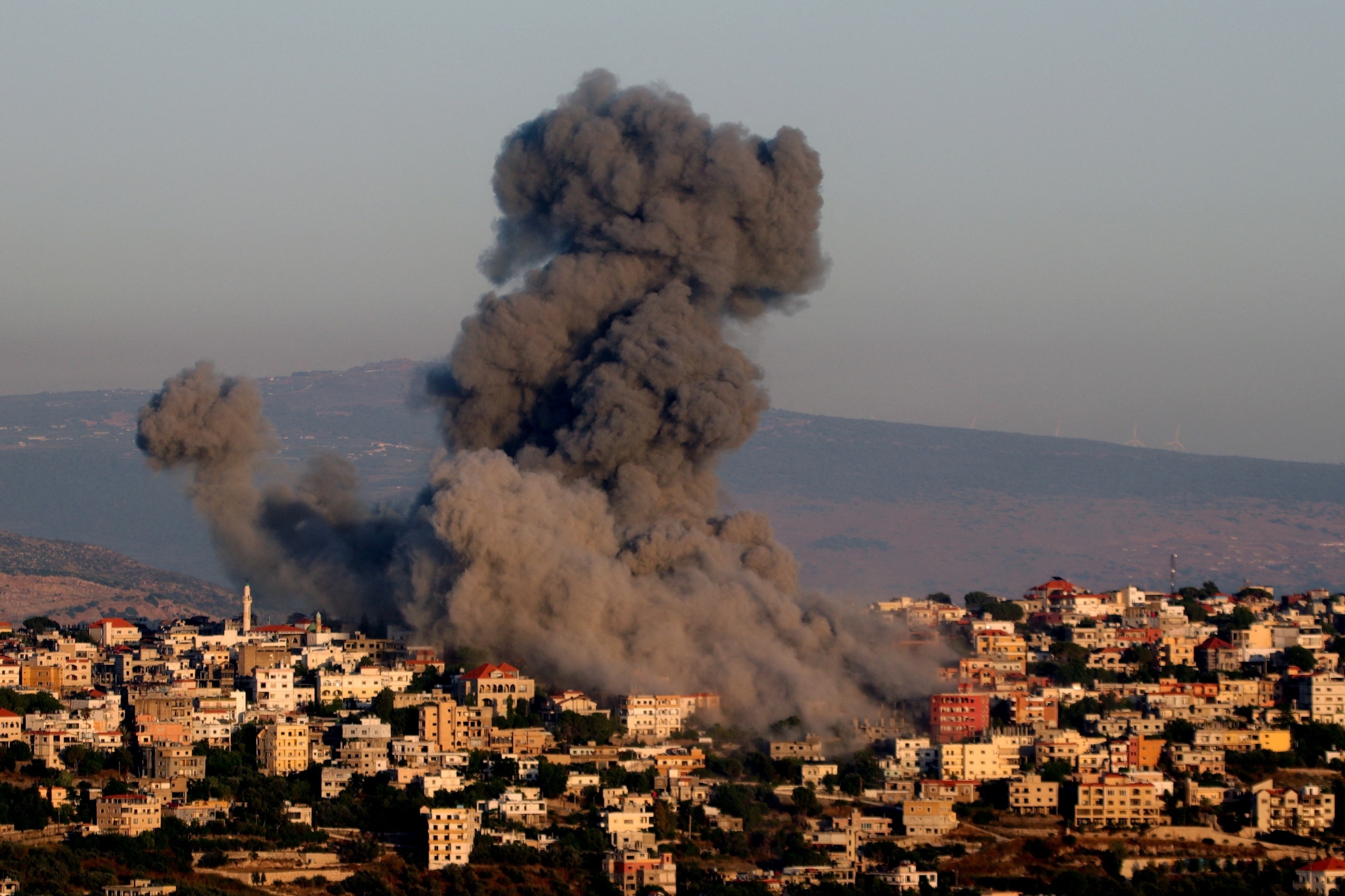 PHOTO: Black smoke billows following an Israeli air strike that targeted a house in the southern Lebanese village of Khiam near the Lebanese-Israeli border, June 21, 2024, amid ongoing cross-border clashes between Israeli troops and Hezbollah fighters. 