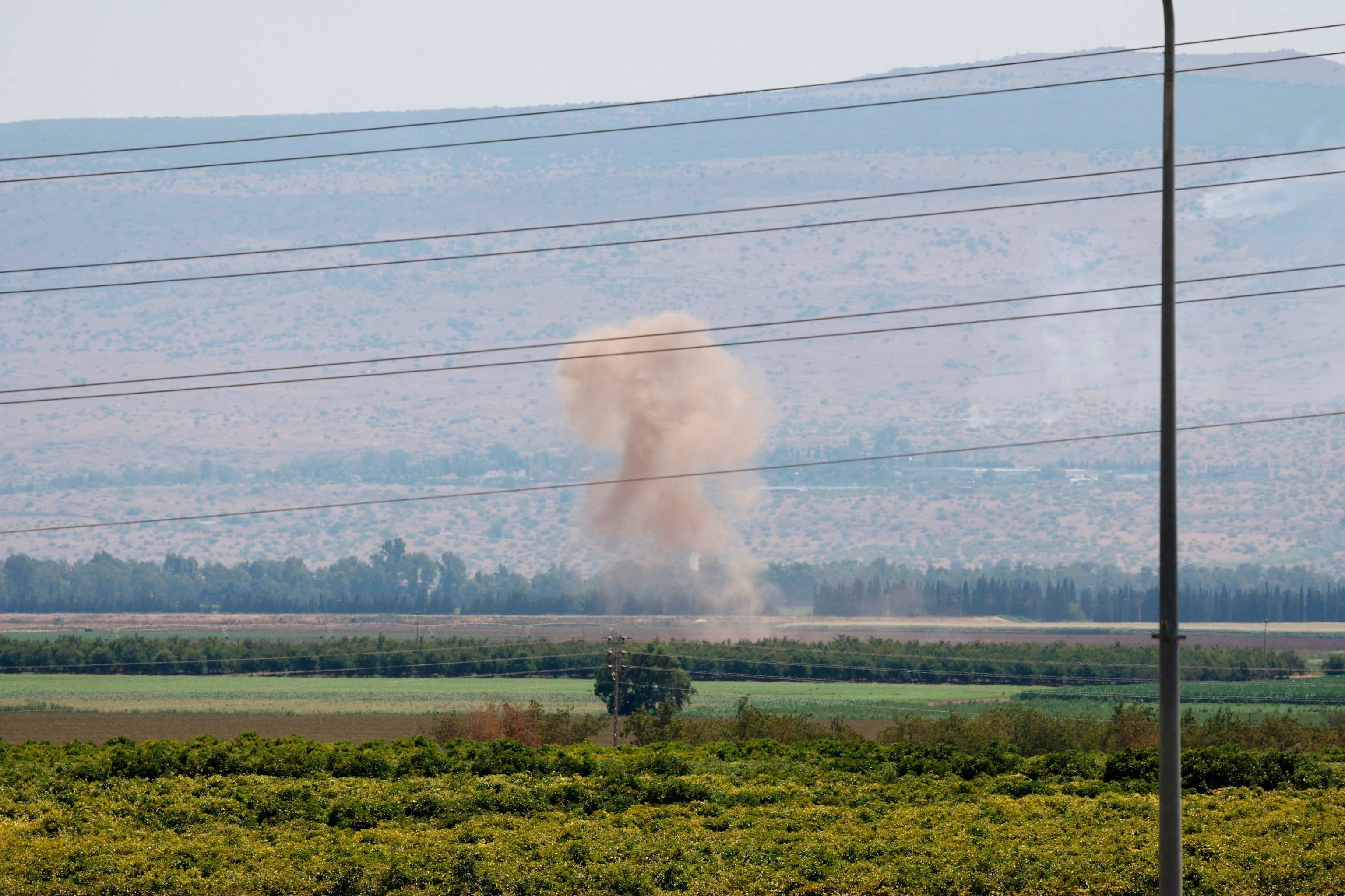 PHOTO: Smoke billows after a hit from a rocket fired from southern Lebanon over the Upper Galilee region in northern Israel on July 4, 2024.