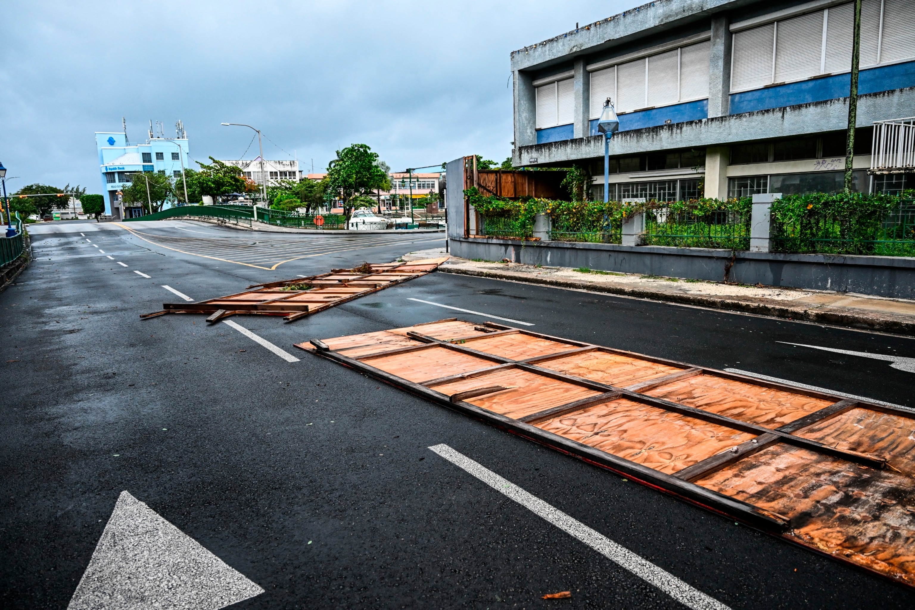 PHOTO: Billboards are seen fallen on the street as hurricane Beryl passes near to Bridgetown, Barbados on July 1, 2024. 