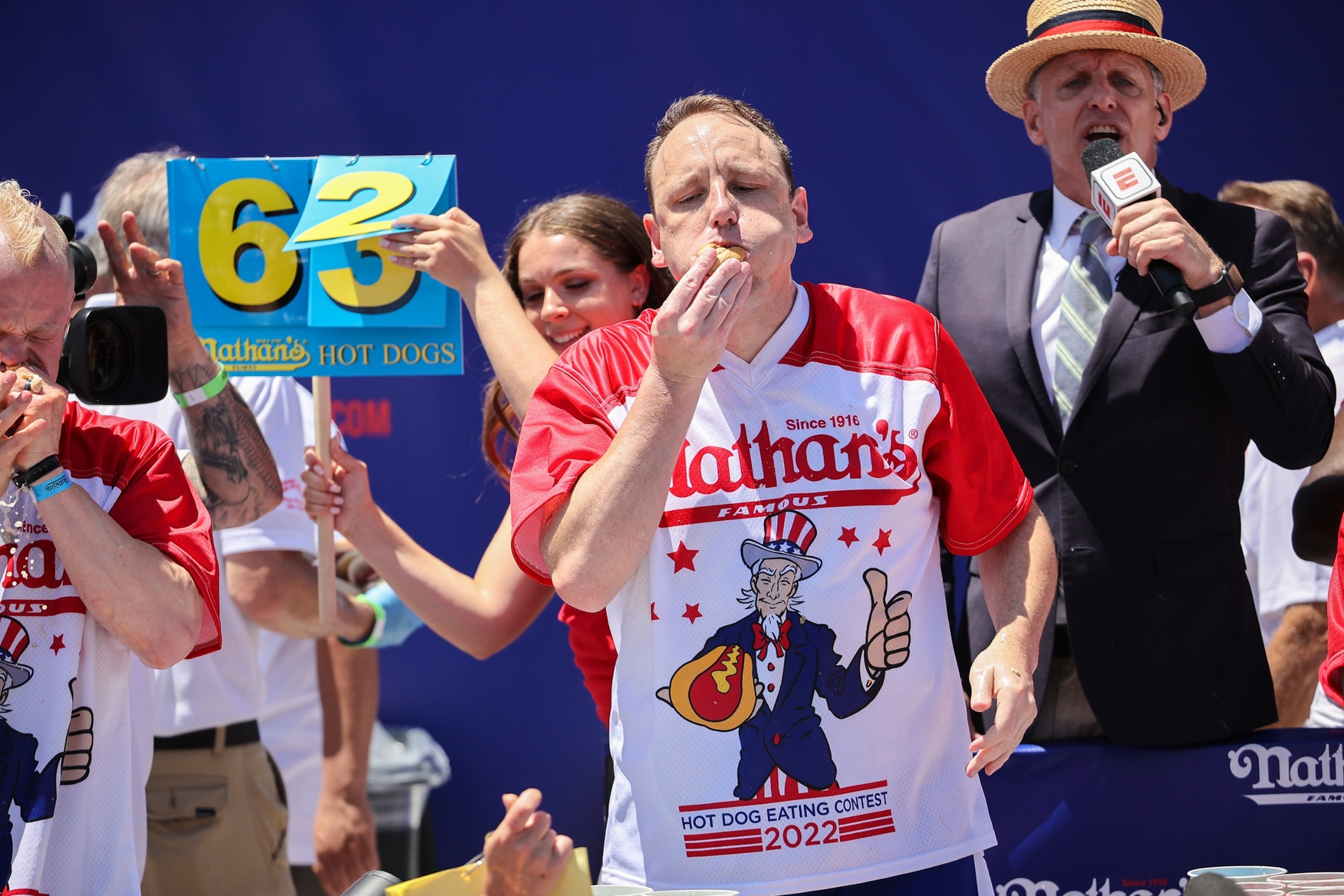 PHOTO: In this July 4, 2022, file photo, Joey Chestnut won first place eating 63 hot dogs in 10 minutes during the men 2022 Nathan's Famous International Hot Dog Eating Contest in Coney Island, New York.