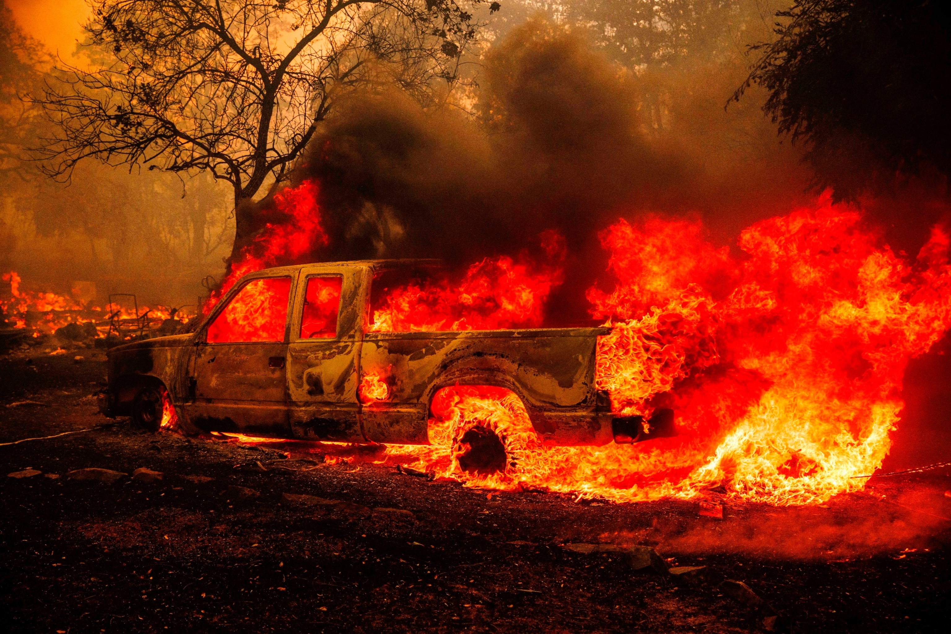 PHOTO: A property is engulfed in flames as the Thompson Fire burns, Tuesday, July 2, 2024, in Oroville, Calif.