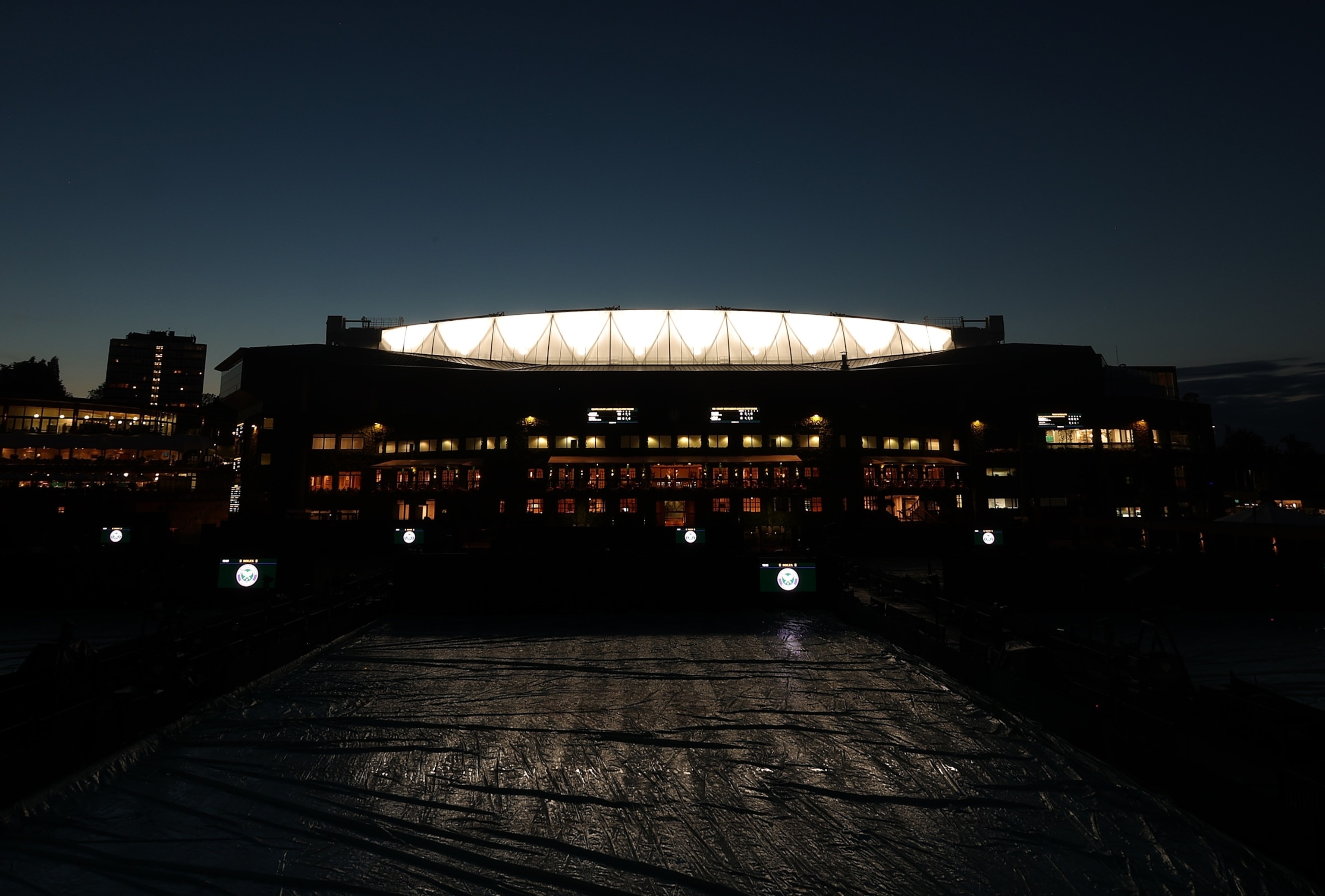 PHOTO: A view outside Centre Court at sunset during day three of The Championships Wimbledon 2023 at All England Lawn Tennis and Croquet Club on July 5, 2023 in London.