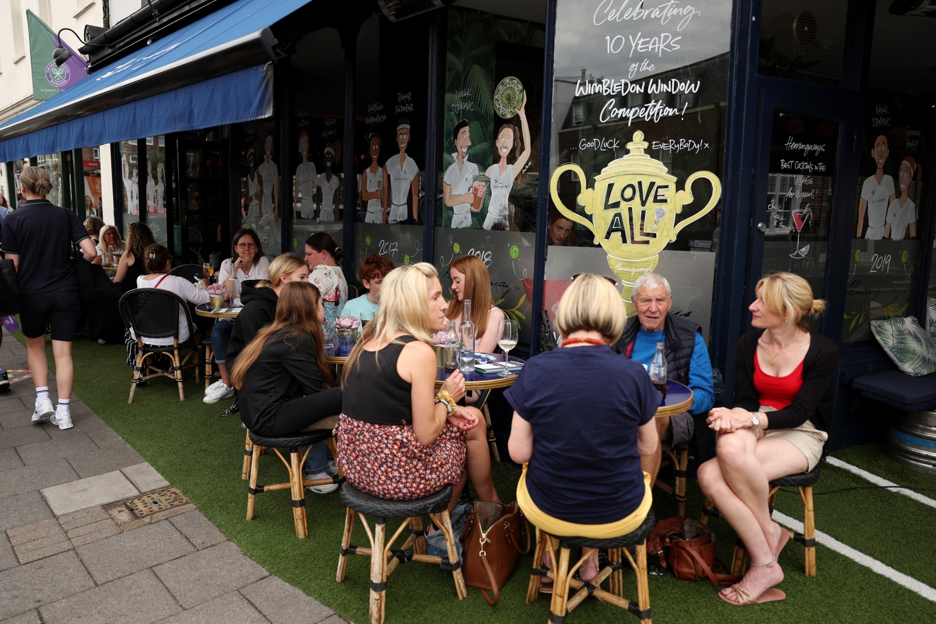 PHOTO: Members of the public are seen having refreshments in Wimbledon village during day six of The Championships Wimbledon 2023 at All England Lawn Tennis and Croquet Club on July 8, 2023 in London.